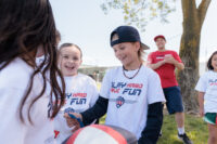 Happy child talking with teammates, engaging in a positive conversation
